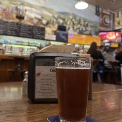 Baumgartner's Cheese Store & Tavern - Glass of Huber Bock $4 at a table in the bar