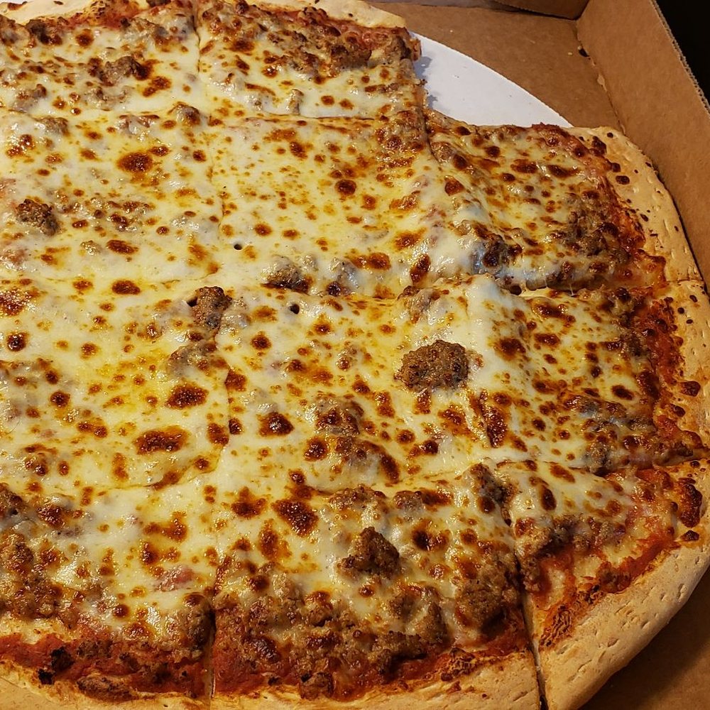 Large sausage pizza minus the 2 little pieces that I couldn't wait to eat! Large sausage pizza minus the 2 little pieces that I couldn't wait to eat!