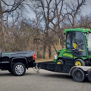 Manny's Lawn & Snow - a green tractor and a black truck - Lawn Services Near Me - Fargo, North Dakota Manny's Lawn & Snow - a green tractor and a black truck - Lawn Services Near Me - Fargo, North Dakota