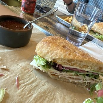 Get Real Sandwiches - Roast turkey sandwich with pickled onions, Swiss cheese, greens, apple and aioli with a side of homemade tomato soup - Sandwiches Near Me - Omaha, Nebraska Get Real Sandwiches - Roast turkey sandwich with pickled onions, Swiss cheese, greens, apple and aioli with a side of homemade tomato soup - Sandwiches Near Me - Omaha, Nebraska