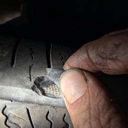 This was the other bald tire - not the flat one - but this one had multiple places where the cords were showing. Blowout imminent. This was the other bald tire - not the flat one - but this one had multiple places where the cords were showing. Blowout imminent.