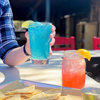 BoomerJack's Grill - a person holding a drink and a plate of tortillas - Sports Bars Near Me - Fairview, Texas BoomerJack's Grill - a person holding a drink and a plate of tortillas - Sports Bars Near Me - Fairview, Texas
