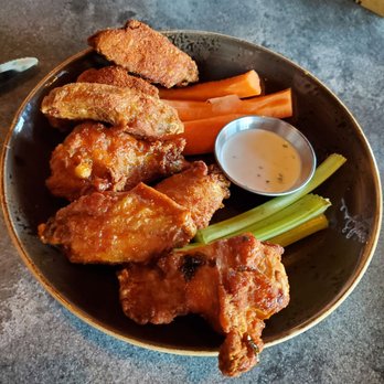 Eureka - Chicken wings... half orange chili half dry rub - American Near Me - Santa Clara, California Eureka - Chicken wings... half orange chili half dry rub - American Near Me - Santa Clara, California