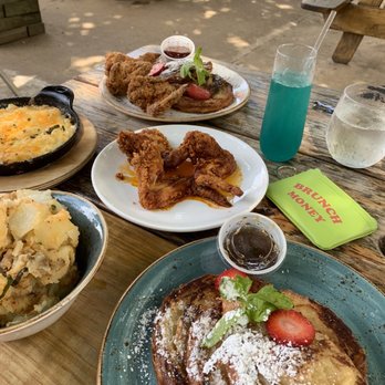 Lucille's - Croissant French Toast (with wings), potatoes, mac & cheese, Blue Tiffany Mimosa - New American Near Me - Houston, Texas