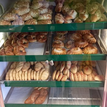 San Carlos Bakery - Top Row: Conchas; Second left: Cuernos; Second Right: Ojos de buey; Third and Last Row: Pan de Elote - Bakeries Near Me - Suitland, Maryland San Carlos Bakery - Top Row: Conchas; Second left: Cuernos; Second Right: Ojos de buey; Third and Last Row: Pan de Elote - Bakeries Near Me - Suitland, Maryland