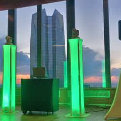 DJ and Booth - DJ Service Rental with two green light pillars