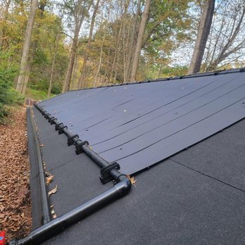 Meiso - a flat roof with a metal gutter - General Contractors Near Me