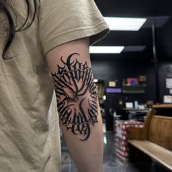 Golden Child Tattoo & Piercing Shop - Sixer Elbow Portal
