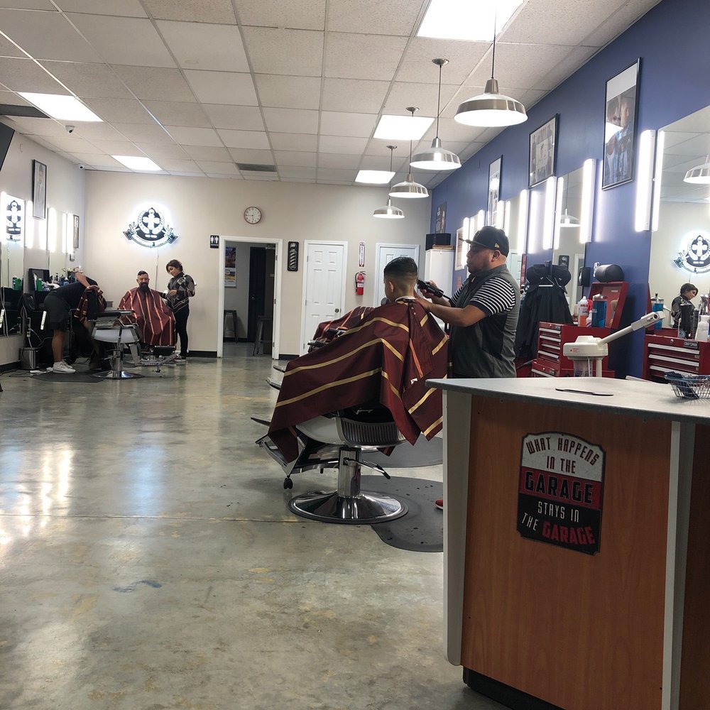 My son getting  a haircut by Manny.