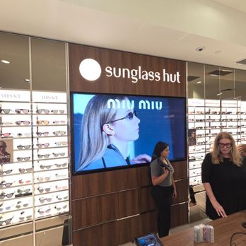 Sunglass Hut - The lady on the right with blonde hair and black dress looks like our saleslady. - Sunglasses Near Me - Aventura, Florida Sunglass Hut - The lady on the right with blonde hair and black dress looks like our saleslady. - Sunglasses Near Me - Aventura, Florida