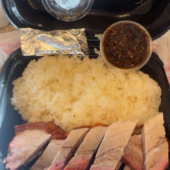 V’s Kitchen - Delicious juicy & crispy pork belly. Comes with sticky rice and the foil spicy dip. I got the container one extra for $1. So good! - Asian Fusion Near Me - Fresno, California V’s Kitchen - Delicious juicy & crispy pork belly. Comes with sticky rice and the foil spicy dip. I got the container one extra for $1. So good! - Asian Fusion Near Me - Fresno, California