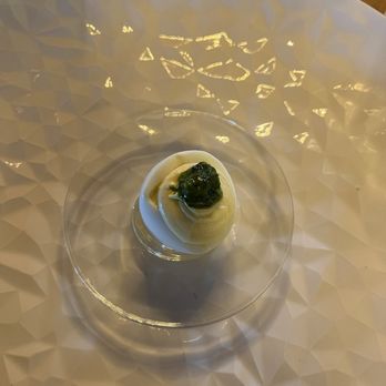Freight House - Deviled egg with chimichurri amuse-bouche before first course. - American Near Me - Paducah, Kentucky Freight House - Deviled egg with chimichurri amuse-bouche before first course. - American Near Me - Paducah, Kentucky