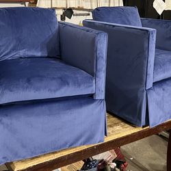 Minmel Upholstery  - Restored pair of 1960s swivel half-barrel club chairs upholstered in luxurious blue velvet with a modern waterfall skirt. Elegant, comfortab