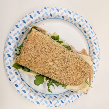 Pisillo Italian Panini - 30. Ariccia Panini - half of the sandwich on a 10" paper plate - Italian Near Me - New York, New York Pisillo Italian Panini - 30. Ariccia Panini - half of the sandwich on a 10" paper plate - Italian Near Me - New York, New York
