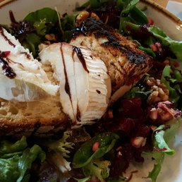 Pizza and salad with goats cheese