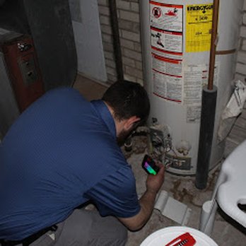 MichiganPro Home Inspection - Kase is inspecting the Water heater for metal flaking, rust, age issues and leaks. - Home Inspectors Near Me MichiganPro Home Inspection - Kase is inspecting the Water heater for metal flaking, rust, age issues and leaks. - Home Inspectors Near Me