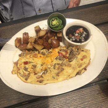 The '401 - Tex-Mex Omelet with roasted potatoes, black bean soup on side with fresh sliced jalapeños (upon request) - American Near Me - Bellaire, Texas