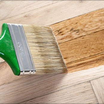 Koster's Wood Floor Store - a closeup of a paint brush on a wood floor - Flooring Near Me - Syracuse, New York Koster's Wood Floor Store - a closeup of a paint brush on a wood floor - Flooring Near Me - Syracuse, New York