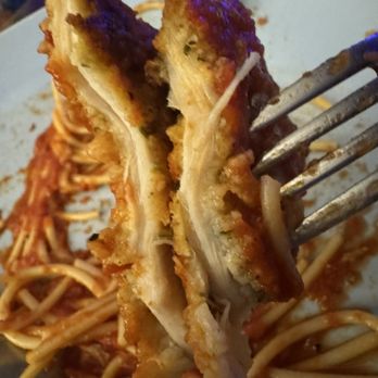 Mandolas Italian Kitchen - that's 2 pieces of chicken stacked to try & show how thin. It also has no flavor! - Italian Near Me - Oldsmar, Florida