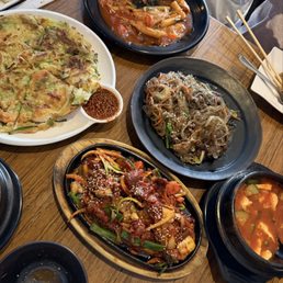 seafood pancake, tteokbokki, japchae, spicy pork, soft tofu soup seafood pancake, tteokbokki, japchae, spicy pork, soft tofu soup