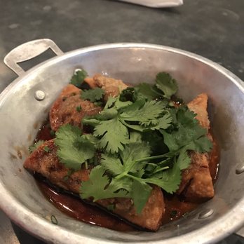 Rising Son - Breakfast dumplings. Sausage fillings inside fried dough and topped with cilantro (coriander) and maple syrup. - Southern Near Me - Avondale Estates, Georgia Rising Son - Breakfast dumplings. Sausage fillings inside fried dough and topped with cilantro (coriander) and maple syrup. - Southern Near Me - Avondale Estates, Georgia