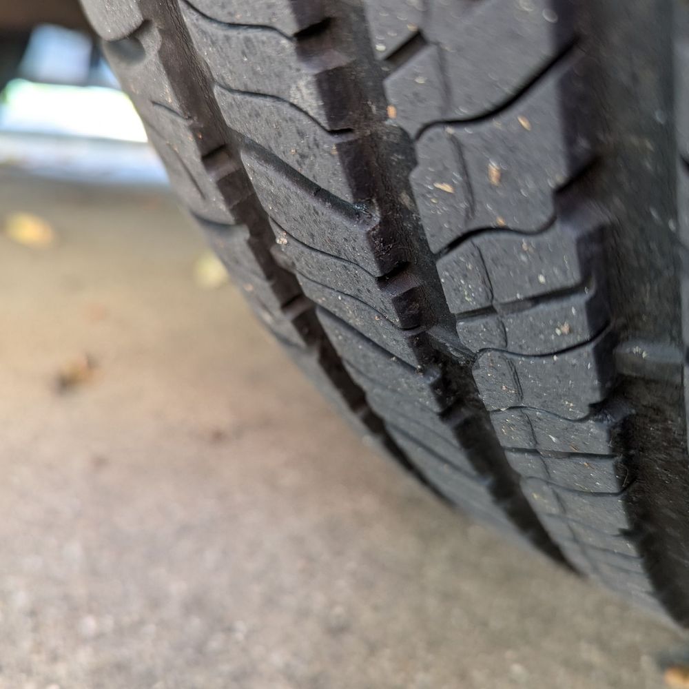 Photo showing tread wear indicator (bar). Discount Tire disingenuously told me I needed 4 new tires due to wear.