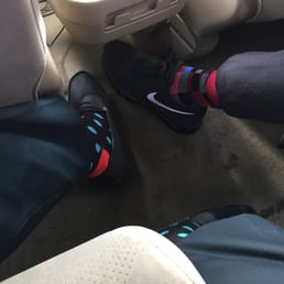 Our happy socks and feet on top of filthy stained beige carpet.