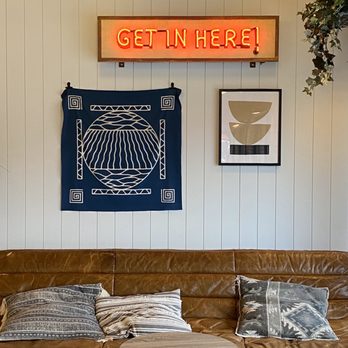 Foxtrot - a couch with pillows and a sign that says get in here - Beer, Wine & Spirits Near Me - Chicago, Illinois Foxtrot - a couch with pillows and a sign that says get in here - Beer, Wine & Spirits Near Me - Chicago, Illinois