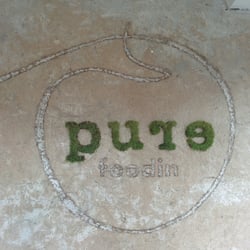 Pure Hero - Logo on the wall.