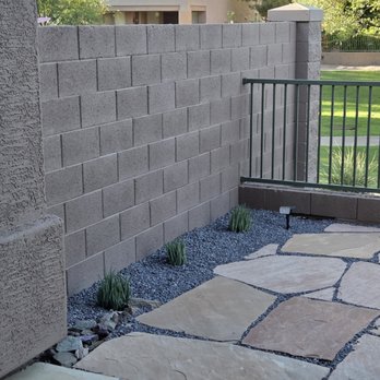 Greenheart Landscapes - Added plants and gray gravel as a contrast to tie into existing flagstone and gray lines in new patio. - Landscaping Near Me - Tempe, Arizona Greenheart Landscapes - Added plants and gray gravel as a contrast to tie into existing flagstone and gray lines in new patio. - Landscaping Near Me - Tempe, Arizona