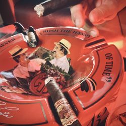 Ashtray with cigars at Fusion Cigar Lounge