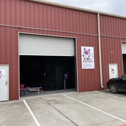 We're in the third building when you drive into the complex - the red one. :)