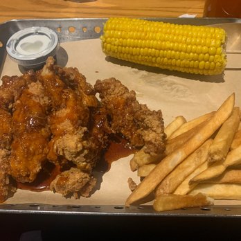Chili's - a tray of chicken wings, french fries and corn on the cob - Tex-Mex Near Me - Andover, Massachusetts