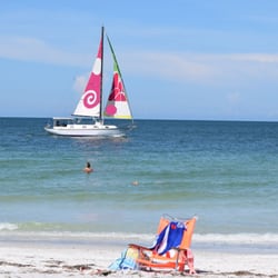 Sailing past sunset beach