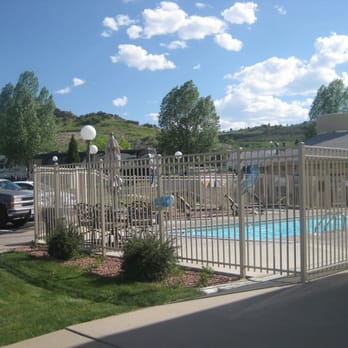 Dakota Ridge Rv Park - Pool and hill behind park where rattlers live! - RV Parks Near Me - Golden, Colorado
