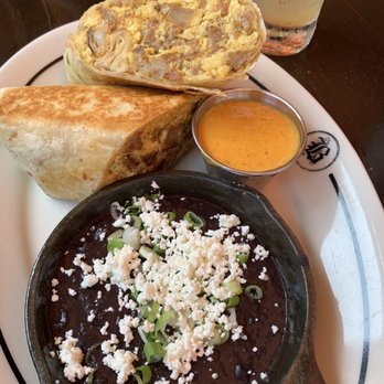 Bosscat Kitchen & Libations - Burrito with tasty dipping sauce and beans - New American Near Me - Irvine, California Bosscat Kitchen & Libations - Burrito with tasty dipping sauce and beans - New American Near Me - Irvine, California