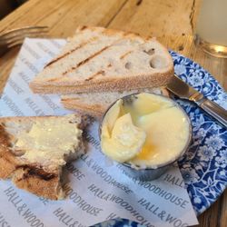 Hall & Woodhouse - Sourdough and butter (two slices of bread with butter).
