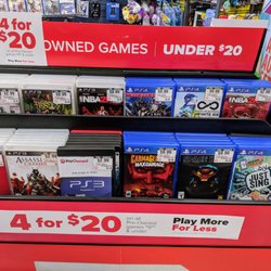 4 games for $20 display. PS3, PS4, Xbox 360, Xbox One.