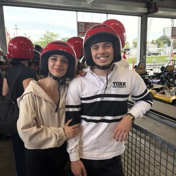 Niagara Speedway - In line, securing helmets before riding. - Go Karts Near Me - Niagara Falls, Ontario Niagara Speedway - In line, securing helmets before riding. - Go Karts Near Me - Niagara Falls, Ontario