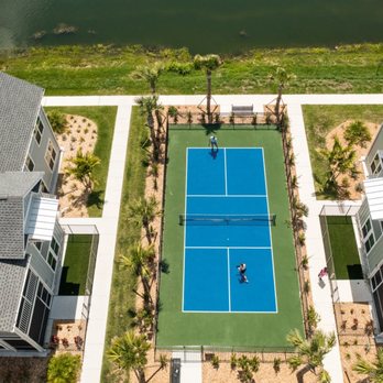 Palm Grove Luxury Apartments - Aerial view of the tennis court - Apartments Near Me - Ellenton, Florida Palm Grove Luxury Apartments - Aerial view of the tennis court - Apartments Near Me - Ellenton, Florida