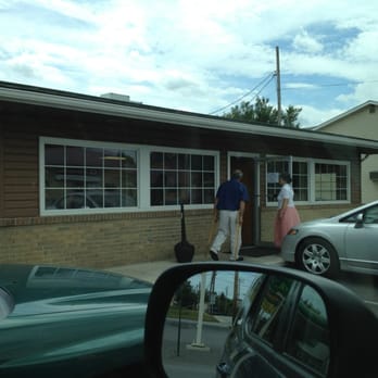 Sunset Restaurant - a man and a woman standing outside of a restaurant - American Near Me - Moorefield, West Virginia