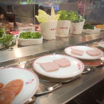 Hotpot City - The conveyor idea for the veggies, seafood and other add-ins is a great idea. - Hot Pot Near Me - Seattle, Washington Hotpot City - The conveyor idea for the veggies, seafood and other add-ins is a great idea. - Hot Pot Near Me - Seattle, Washington