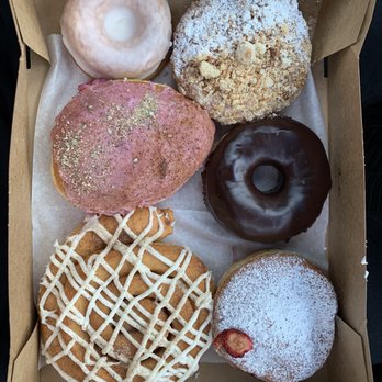 The Goods - Top: Tahitian Vanilla, Almond Teacake Mid: Cranberry cheesecake, Chocolate Ganache Low: Tiramisu Cinnamon Roll, Seasonal Berry - Donuts Near Me - Carlsbad, California