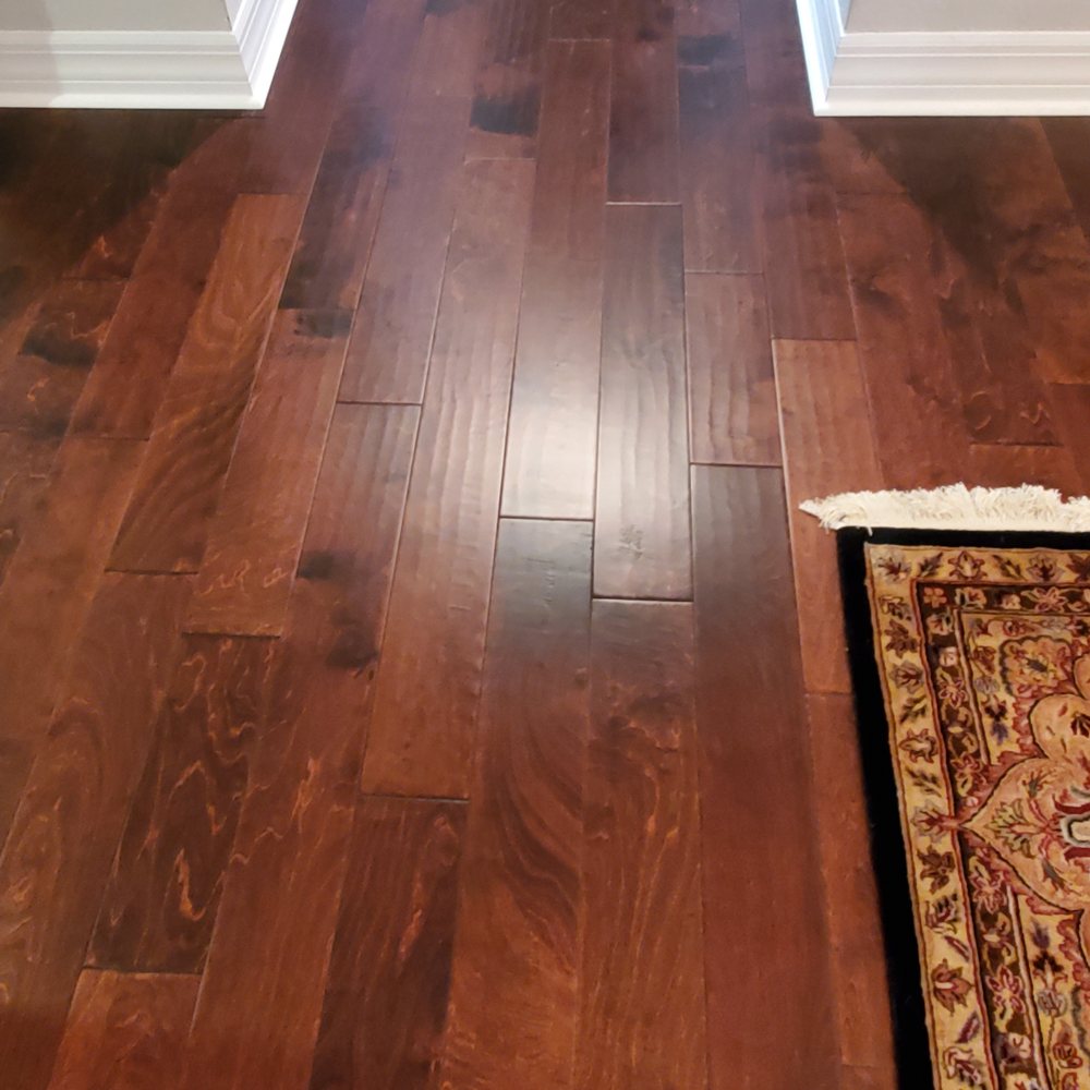 The Floor Meisters - a hardwood floor in a hallway - Flooring Near Me - Naples, Florida The Floor Meisters - a hardwood floor in a hallway - Flooring Near Me - Naples, Florida