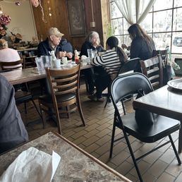 Chairs metal folding mixed in with dining chairs. Even at the same table.