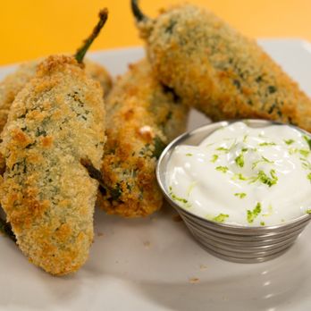 Village Kitchen - a plate of fried jalapenos with sour cream - Vegan Near Me - Decatur, Georgia Village Kitchen - a plate of fried jalapenos with sour cream - Vegan Near Me - Decatur, Georgia