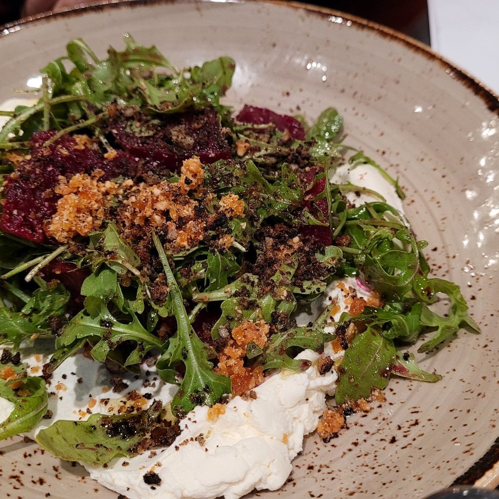 Campfire Adirondack Grill - Beet salad, w/ ricotta, arugula,  peanut praline, juniper berry vinegarette, grilled bread crumbs, $11 - Breakfast & Brunch Near Me - Saranac Lake, New York