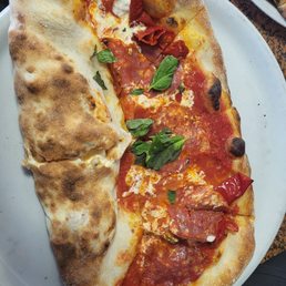 Mezzaluna, half calzone and half pizza. I chose the Diavola pizza and pepperoni in the calzone. IT WAS DELICIOUS. Mezzaluna, half calzone and half pizza. I chose the Diavola pizza and pepperoni in the calzone. IT WAS DELICIOUS.