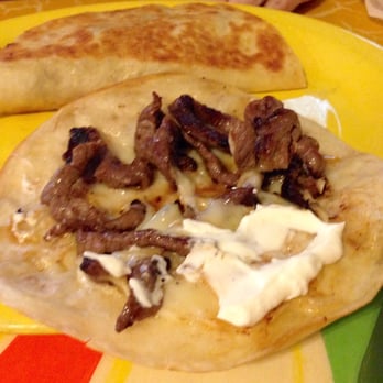 Margarita's - Fajita Quesadillas (steak with onions, bell peppers, cheese, guacamole, sour cream salad, refried beans & rice) - Mexican Near Me - Myrtle Beach, South Carolina Margarita's - Fajita Quesadillas (steak with onions, bell peppers, cheese, guacamole, sour cream salad, refried beans & rice) - Mexican Near Me - Myrtle Beach, South Carolina