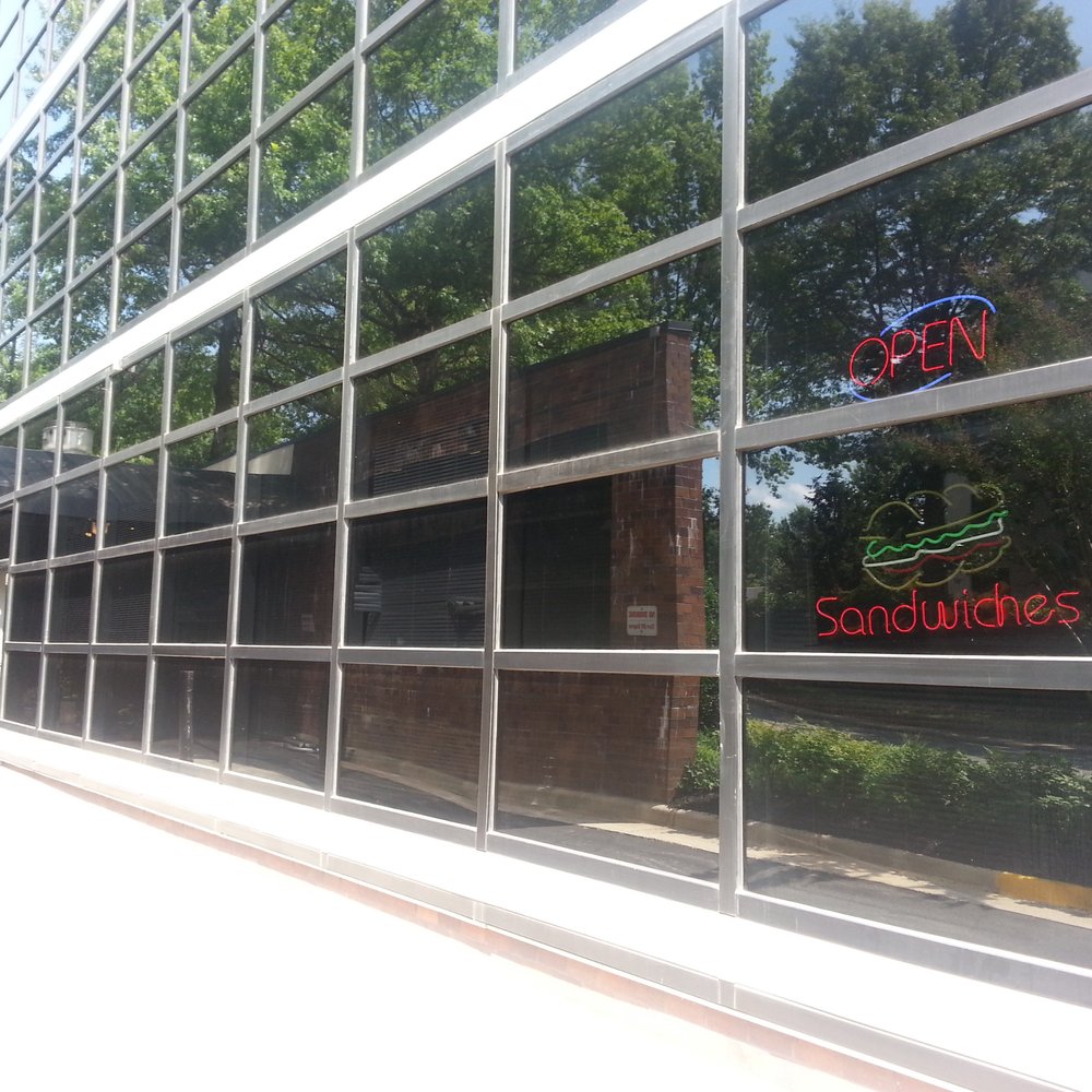 the reflection of the building across the street